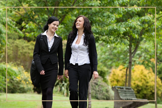 business women walking outdoors